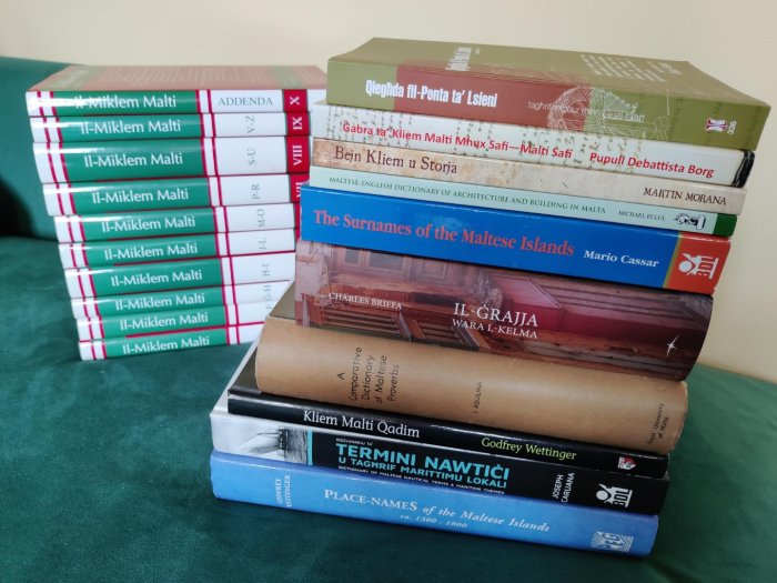 Two piles of books of Maltese dictionaries and books about the Maltese language