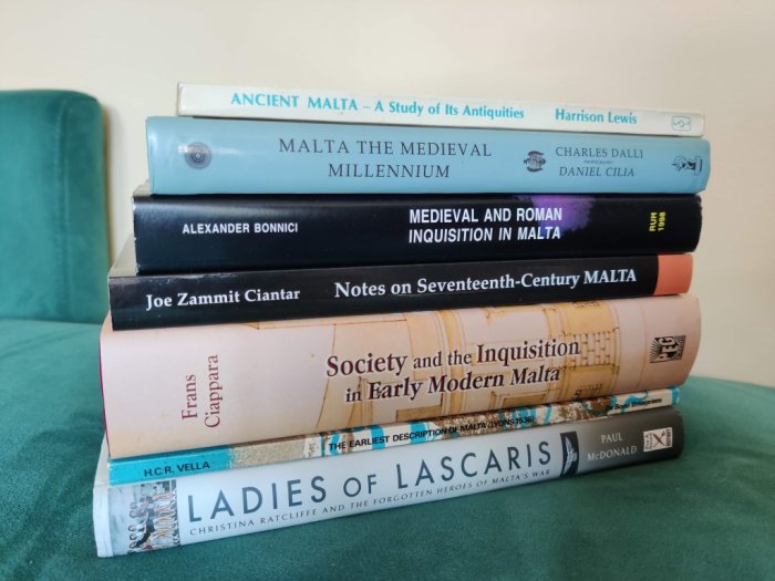 A pile of books about Maltese history
